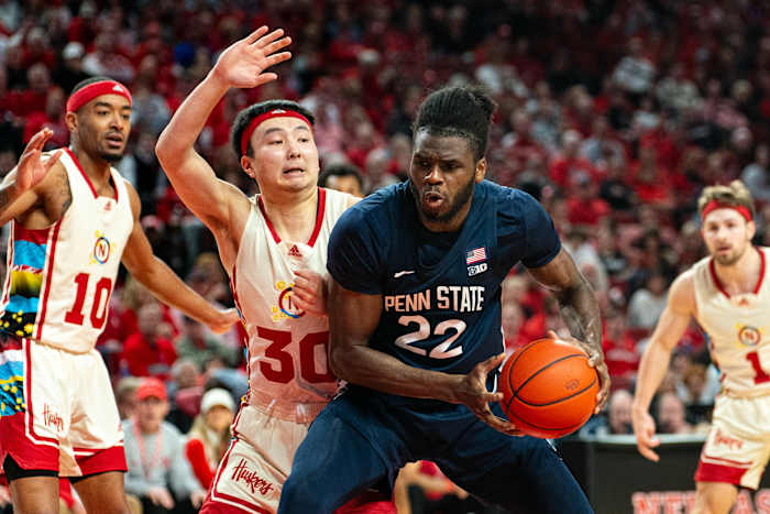 Feb 17, 2024; Lincoln, Nebraska, USA; Penn State Nittany Lions forward Qudus Wahab (22) drives against Nebraska Cornhuskers guard Keisei Tominaga (30) during the second half at Pinnacle Bank Arena.